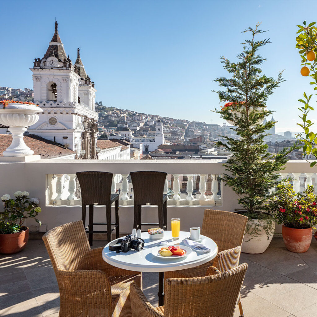 Luxury facade of Casa Gangotena Boutique Hotel overlooking Plaza de San Francisco in Quito's Historic Center.